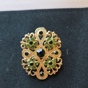 Elegant Gold and Green Brooch